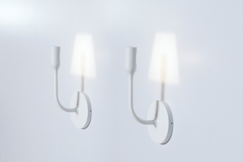 A studio image of a pair of Innermost's YOYWall wall sconce, designed by YOY Studio