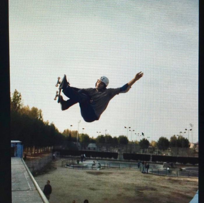 A young Jaime Hayón busts a sick move on his skateboard in a halfpipe.