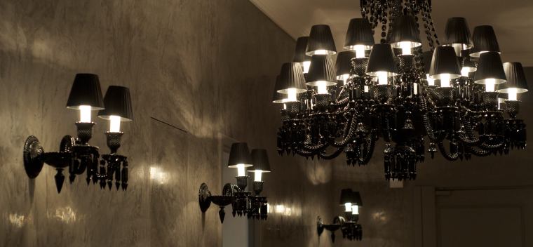 Baccarat's Zenith Noir wall light and Zenith Noir chandelier.