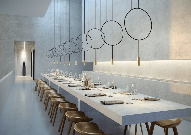 A long banquet table illuminated by a linear cluster of Revolta t-3635-w 1 Light pendant lights.