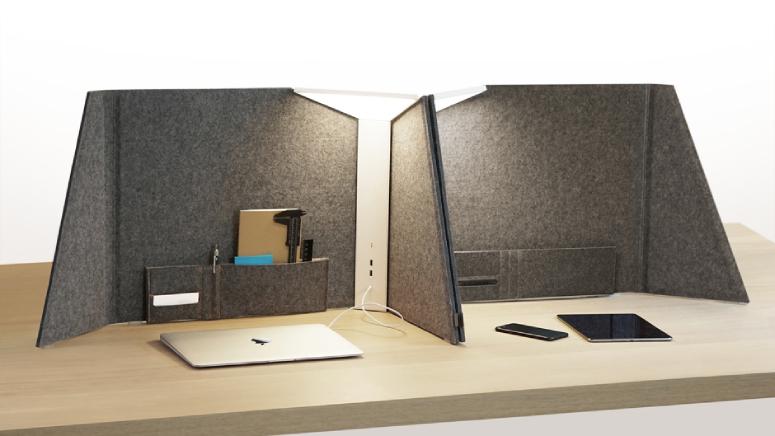 A custom arrangement of Pablo Design's Corner Office, designed by Peter Stathis and Michael McCoy, on a wooden desk.