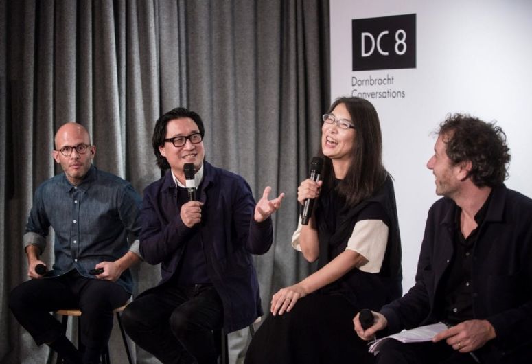 Neri & Hu Design sits on a stage mid-interview.