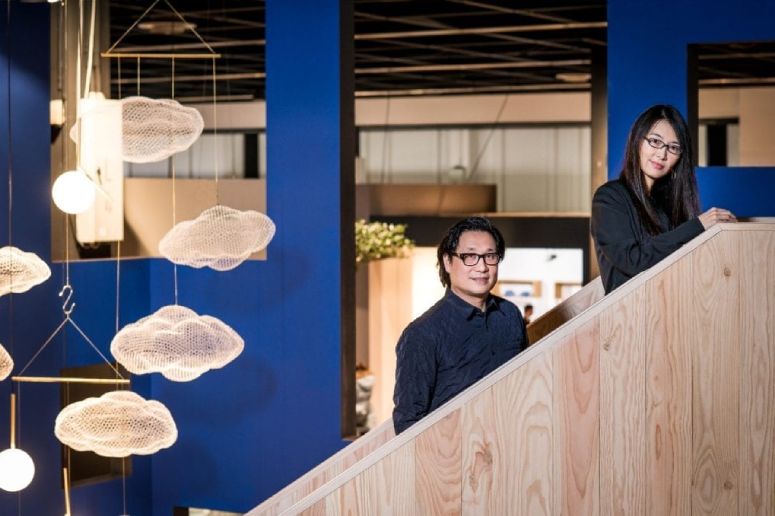 Neri & Hu's design team poses for the camera with several of their luminaires.