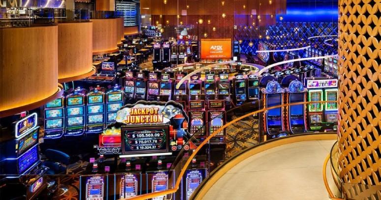 A view of the slots floor in Grand Villa Casino from above, with custom installations of Liquid Line suspension lights from Lightnet. LightPhoto provided by Kasian Architecture.