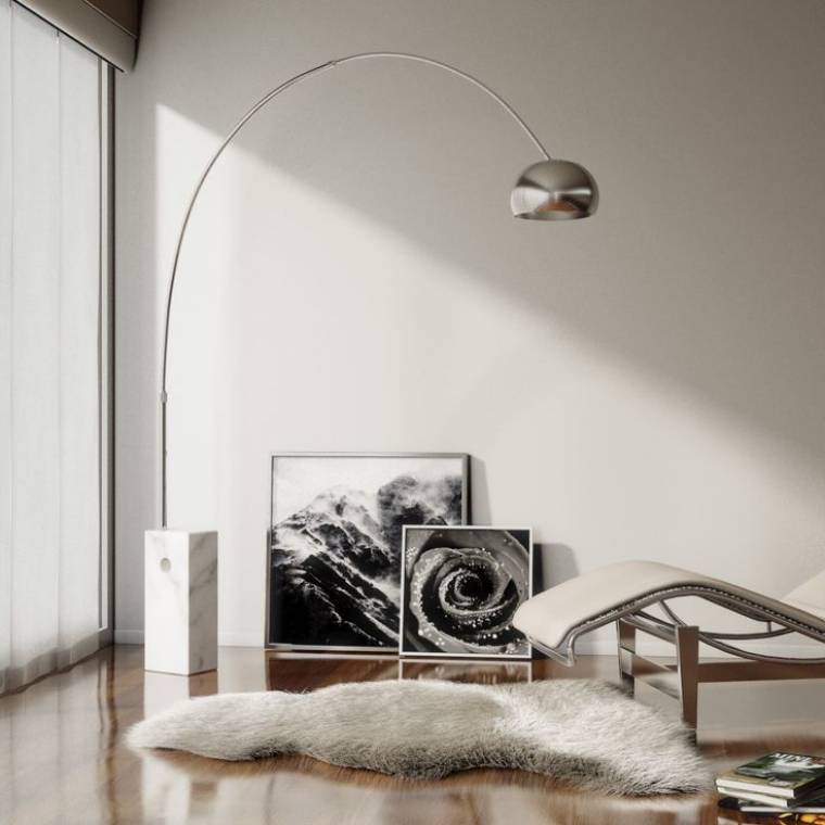 Arco floor light's head hangs over a chair and faux-fur rug in a sleek contemporary living room.