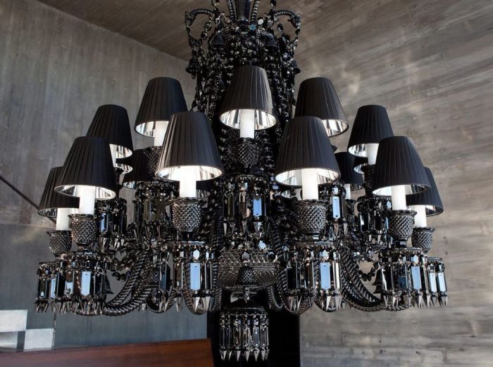 Zenith Noir suspension light, Philippe Starck's revision of the Zenith suspension lighting design for Baccarat, hangs above a foyer, its lighting heads covered by the optional black shades for an extra level of drama.