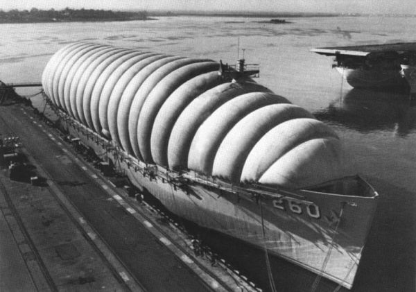 The American battleship USS Betelgeuse (AK-260), being mothballed for preservation. The cocoon-like form of the deck cover helped inspire the form of George Nelson's Bubble Lamps.