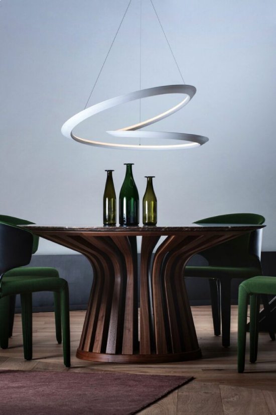 A marble-topped lounge table is illuminated by Arihiro Miyake's Kepler suspension for NEMO.