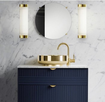 A bathroom vanity illuminated from either side by Pillar wall lights from Original BTC's Davey Lighting collection