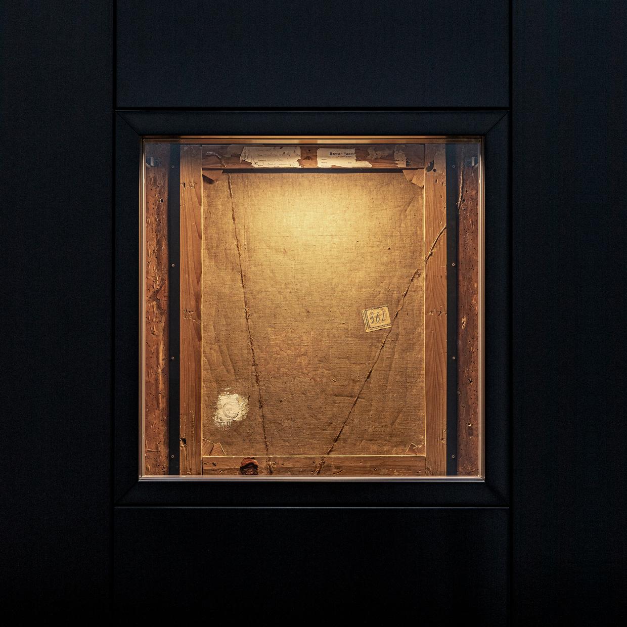 A view of the weathered rear of Portrait of a Lady's canvas and frame.