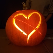 A jack-o'-lantern featuring a representation of Davide Groppi's Rail wall light