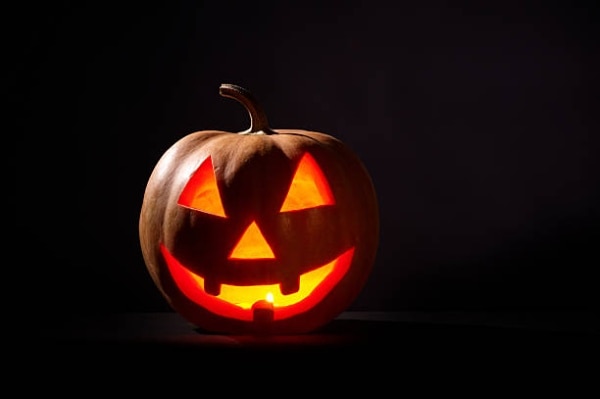 A grinning jack-o'-lantern with moody lighting