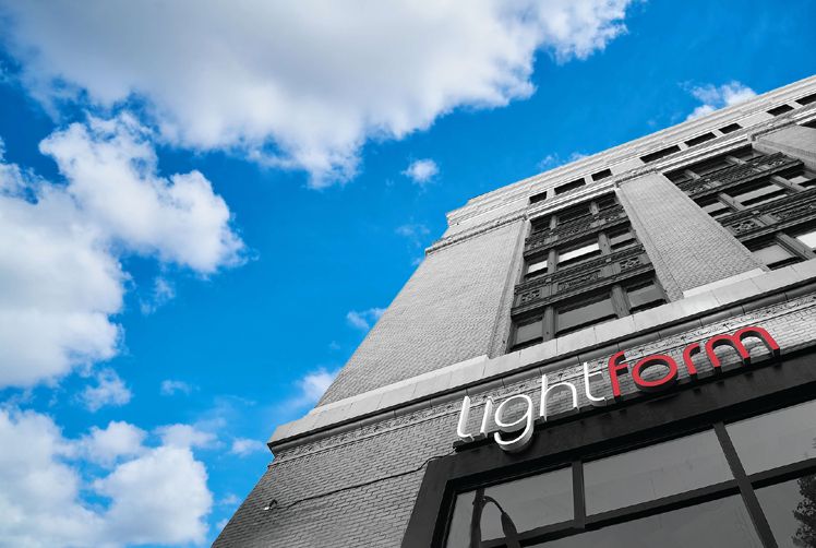 A somewhat artistic vision of LightForm's Vancouver showroom's storefront. Extreme low-angle, with a bright blue sky above.