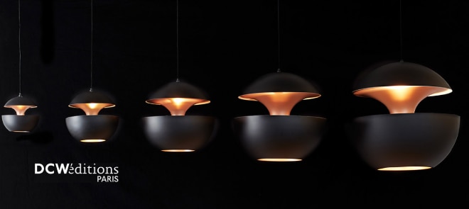 A linear cluster of Here Comes the Sun pendant lights.