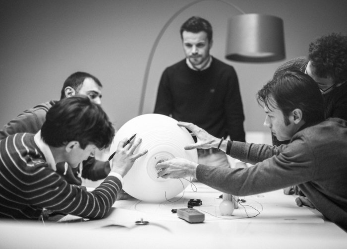 A group of designers work in Foscarini's design studio.