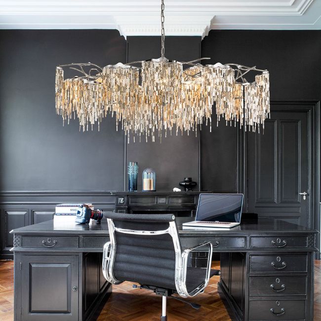 Arthur Suspension Oval chandelier illuminates an office that combines metallic accents and Victorian furniture painted uniform black to create a Modern Glam effect.