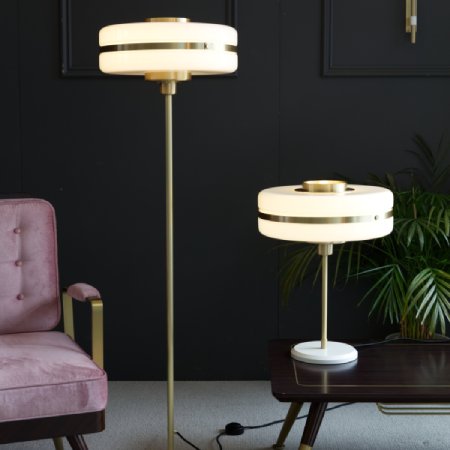 Masina floor and table lamp variants illuminate a modern sitting room.