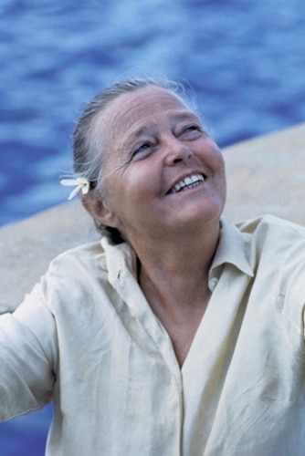 A smiling Charlotte Perriand enjoys the sun on her face during her later years