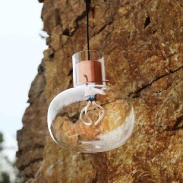 Awa suspension light from Brokis. Fumie Shibata's design shapes blown glass to evoke the organic irregularity of a bubble floating through the air.