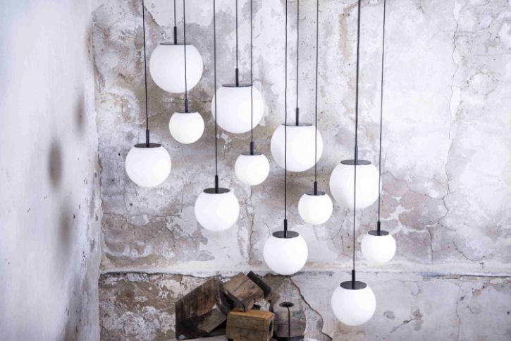 A cluster of variously-sized Sfera pendant lights in a diagonal installation.