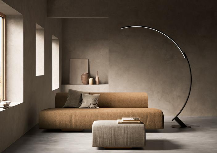 Kyudo floor light from Kundalini illuminates a moody living room.