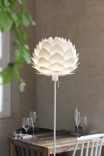 Aluvia Mini Champagne floor light in a shadowed dining space