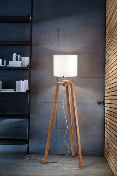 Trepai PT floor light from Umage illuminates a darkened living room.