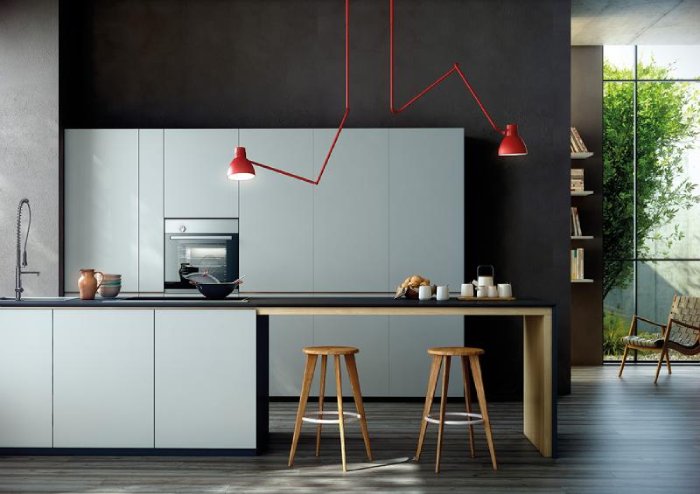 Two Blux System C ceiling lights over a simple kitchen island.