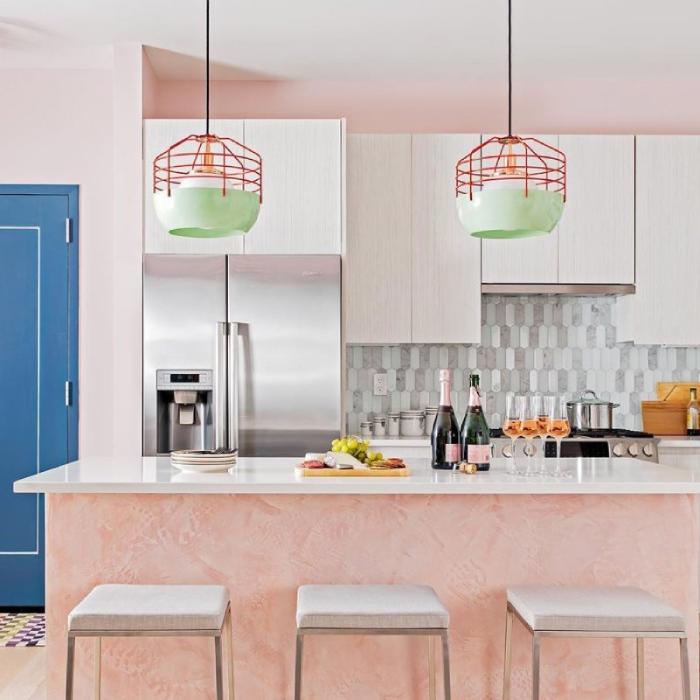 A pair of Jonah Takagi's Bluff City 14" suspension lights over the island in a fun and whimsical modern kitchen.