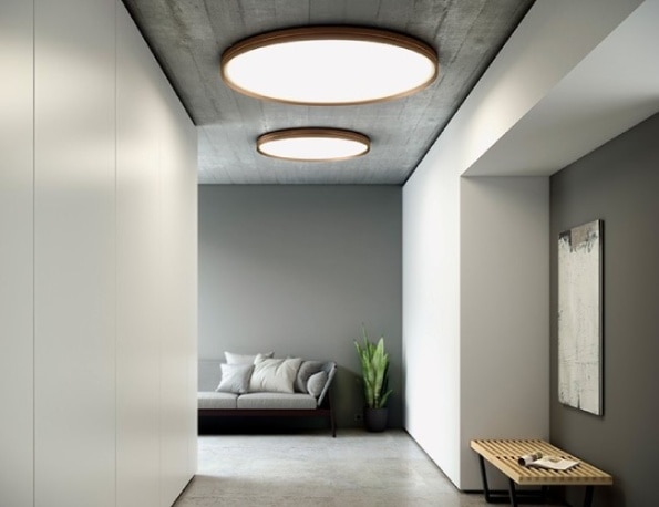 A sleek minimalist hallway illuminated by Lite Hole ceiling lights, designed by David Abad for designer lighting brand B.lux