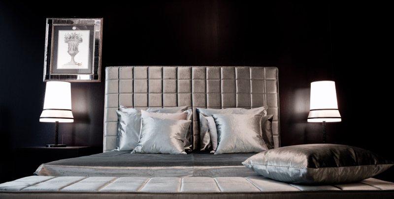 Contardi's Audrey Ta Large table lamp, designed by Massimilano Raggi, on either side of a plush modern bed.