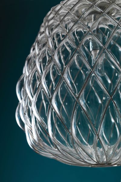 A detail shot of the way FontanaArte's Pinecone suspension light, designed by Paola Navone, refracts light in its facets.