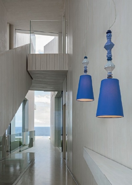 A pair of Belle de Nuit pendant lights hang in a bright modern hallway.