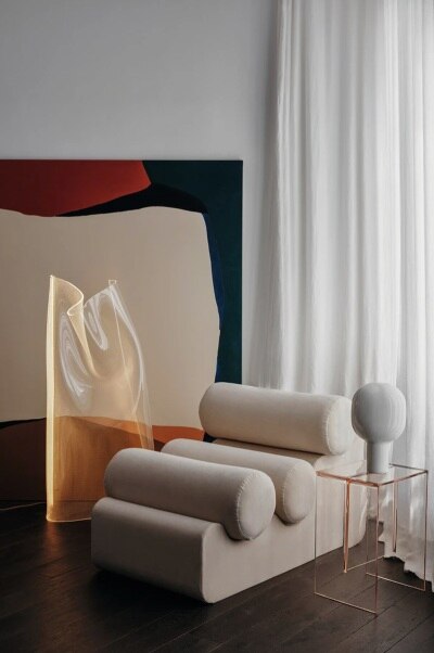 A modern living room featuring Gweilo Han floor light, designed for Parachilna by Canadian design studio PARTISANS.