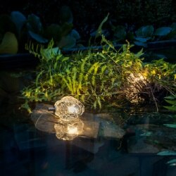 More 0 outdoor floor light from Catellani & Smith brings a touch of magic to a backyard water feature.