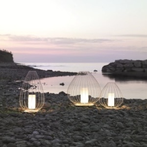 Cell outdoor floor lights illuminate a rocky shoreline.