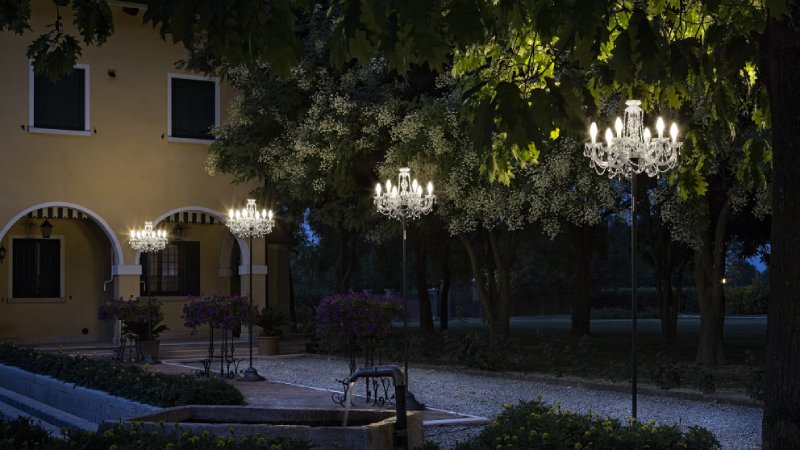 A line of Drylight STL6 outdoor floor lights add a touch of impish opulence to a European courtyard's outdoor lighting plan.