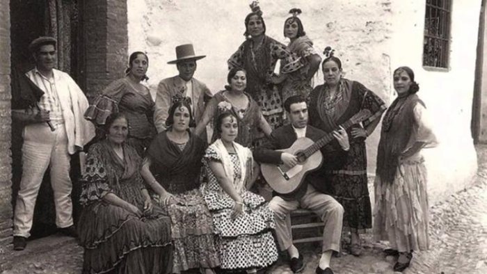 A vintage photo of a traditional flamenco troupe.