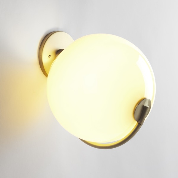 Fiddlehead wall sconce, designed by Jason Miller for Roll & Hill, with the cream glass option.