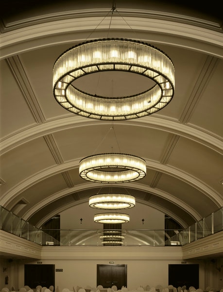 A line of Estadio chandeliers, designed for Santa & Cole by Miguel Milá.