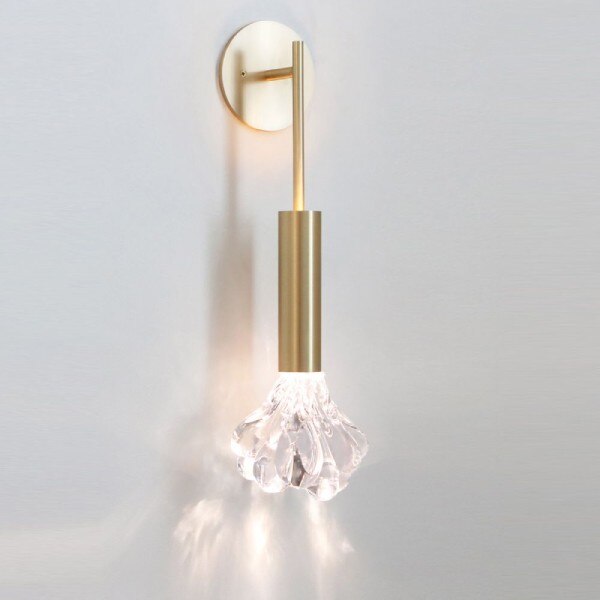 Dew wall sconce from SkLO with the clear glass and brass finish options.