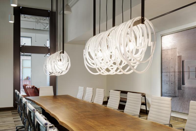 A pair of Lasso Chandelier linear suspension lights from American-Czech lighting brand SkLO