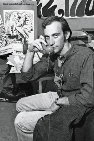 Organizer Denis Hayes sits in Earth Day headquarters on the phone.