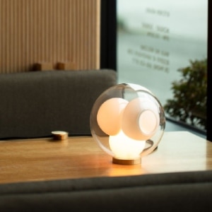 38Vt table lamp from Bocci on a desktop, with its cavities empty.