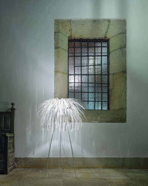 a-emotional light's Tina floor light, designed by Arturo Alvarez, in a rustic interior.