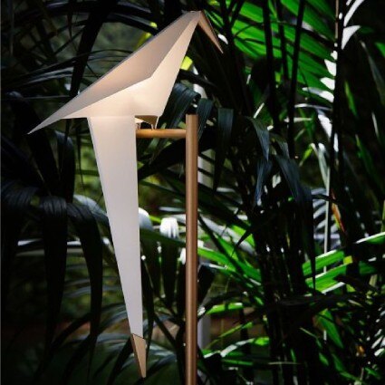 A close-up of the origami bird central to Perch Light floor lamp, designed by Umut Yamac for Moooi