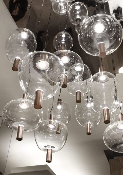 A cluster of Riflesso suspension lights from Italian lighting brand Vistosi.