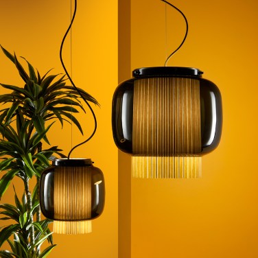 Large and small Manila pendant lights, designed by Sebastian Herkner for Parachilna, hang on a studio set.