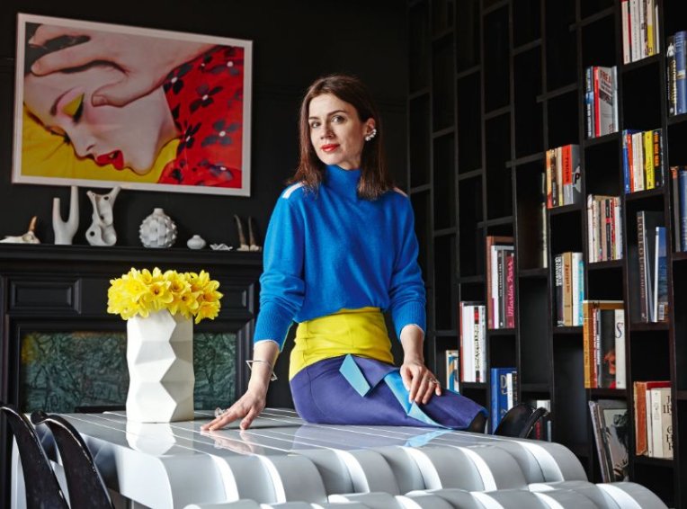 Lara Bohinc poses in a vividly-coloured and contrast-based office.