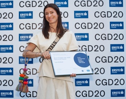 Lucie Koldova holds her 2020 Designer of the Year Award on the red carpet at the Czech Grand Design Awards